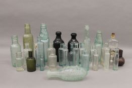 A quantity of vintage glass bottles