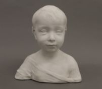 A plaster bust of a child. 26 cm high.