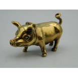 A brass vesta in the form of a pig. 4.5 cm long.