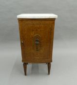 A 19th century French marble topped pot cupboard. 84 cm high.