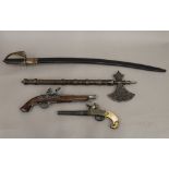 Two replica guns, an axe and a sword. The latter 89 cm long.