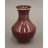 A small Chinese red ground vase. 15 cm high.