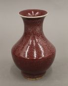 A small Chinese red ground vase. 15 cm high.