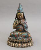 A cloisonne decorated bronze model of Buddha. 27 cm high.