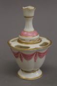 A 19th century porcelain vessel. 11.5 cm high.