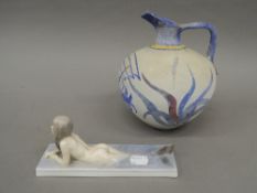 A Royal Copenhagen model of a mermaid and a pottery vase. The former 19.5 cm long.