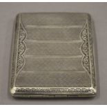 An Art Deco cigarette case, marked Alpacca. 10 cm wide.