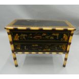 A lacquered faux bamboo two drawer chest of drawers. 86 cm wide, 69 cm high, 39.5 cm deep.