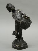 A patinated bronze casting of a putto water carrier, After A Moreau, unsigned. 23.5 cm high.