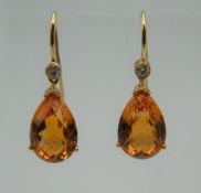A pair of 18 ct gold citrine and diamond drop earrings