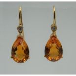 A pair of 18 ct gold citrine and diamond drop earrings