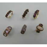 Three 9 ct gold stone set rings,