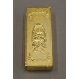 A Chinese deity gilt ingot. 6 cm wide.