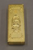 A Chinese deity gilt ingot. 6 cm wide.