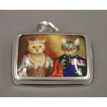 A silver enamel cat pendant. 3 cm wide.