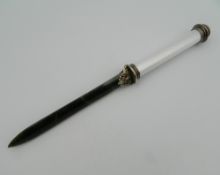 A silver enamel and jade letter opener, bearing Russian marks. 26 cm long.