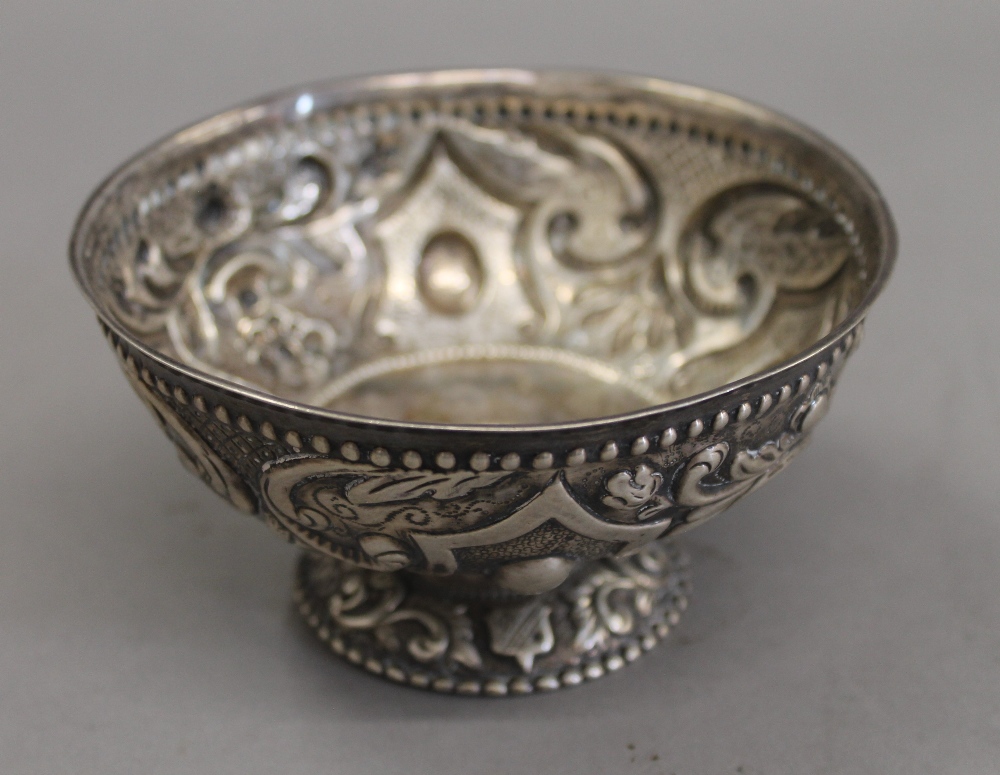 A Continental antique embossed silver footed bowl. 12 cm diameter. 126.8 grammes.