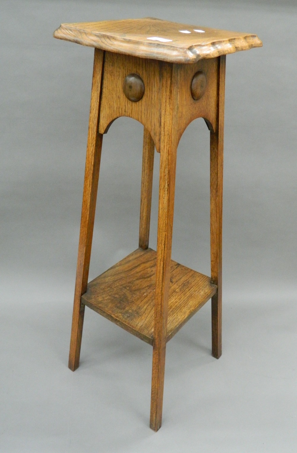 A Victorian oak plant stand.