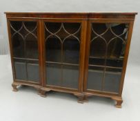 An early 20th century mahogany glazed bookcase. 154 cm wide.