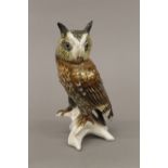 A porcelain model of an owl. 17 cm high.