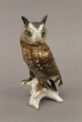 A porcelain model of an owl. 17 cm high.
