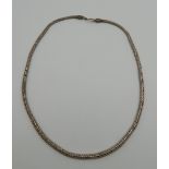 A silver necklace. 58 cm long. 67.