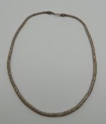 A silver necklace. 58 cm long. 67.