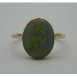 An unmarked gold and opal ring. Ring size P.
