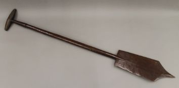 A Polynesian carved wooden paddle. 109.5 cm long.