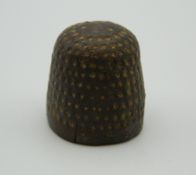 A Medieval beehive thimble. 2 cm high.