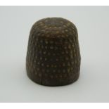 A Medieval beehive thimble. 2 cm high.