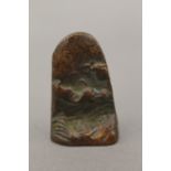 A small bronze seal decorated with a mountainous landscape. 4.5 cm high.