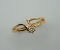 An 18 ct gold and diamond solitaire ring. Ring size M.