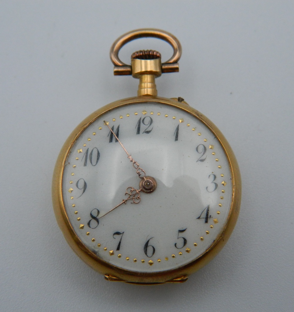 An 18 ct gold ladies fob watch. 2.5 cm diameter. 15.6 grammes total weight.