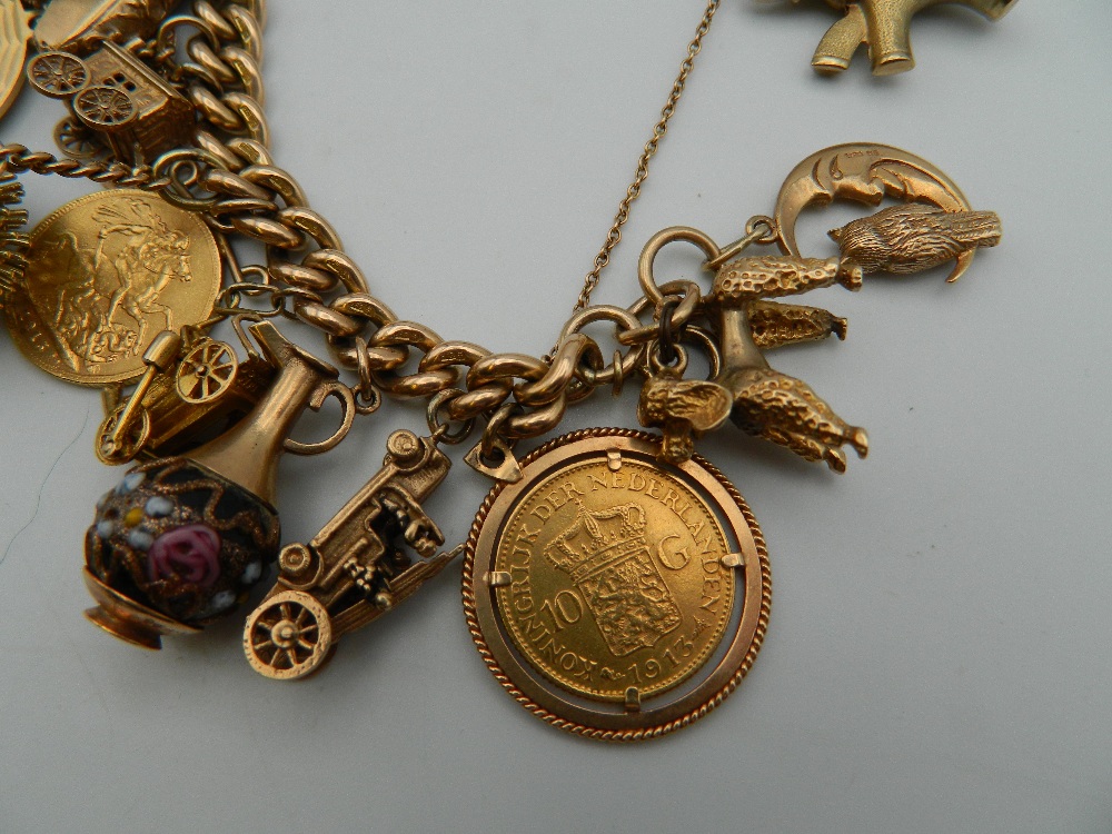 A 9 ct gold charm bracelet, set with various gold coins, including two sovereigns. 218. - Image 2 of 20
