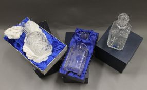 A quantity of various boxed and unboxed decanters.