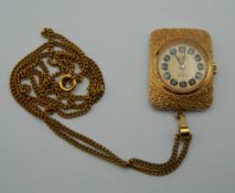 An Emka pendant watch on chain. The pendant 3.25 cm high.