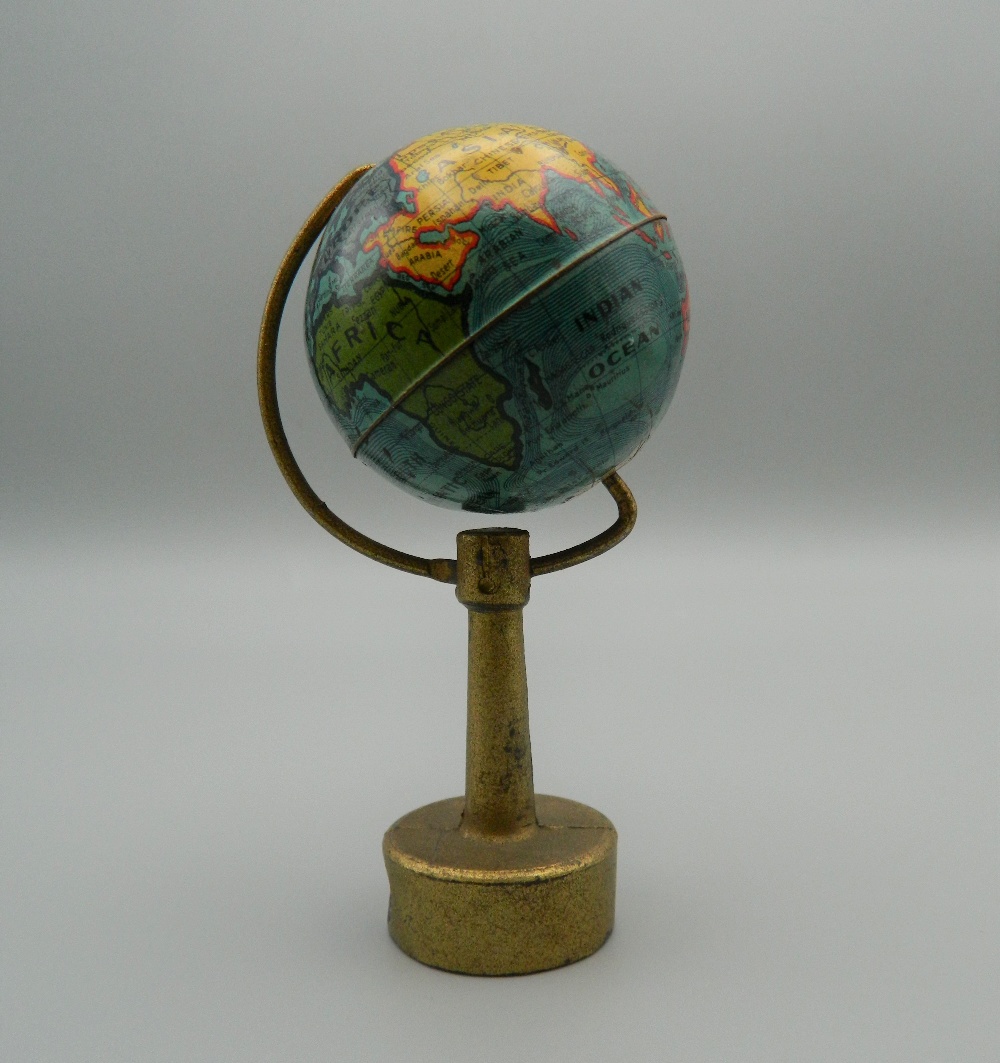 A vintage novelty pencil sharpener formed as a globe. 9 cm high. - Image 2 of 4