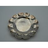 A white metal pin dish. 7.5 cm diameter. 23.8 grammes.