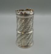 A silver plated pepper formed as a castle. 7 cm high.
