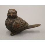 A bronze model of a bird. 5 cm long.