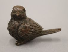 A bronze model of a bird. 5 cm long.