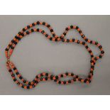 A jet and coral necklace. 47 cm long.
