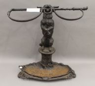 A Victorian Coalbrookdale dog form stick stand. 57 cm high.