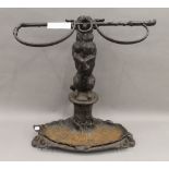 A Victorian Coalbrookdale dog form stick stand. 57 cm high.