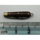 A vintage miniature penknife. 2.25 cm long closed.