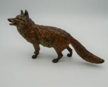 A cold painted bronze model of a fox. 19 cm long.