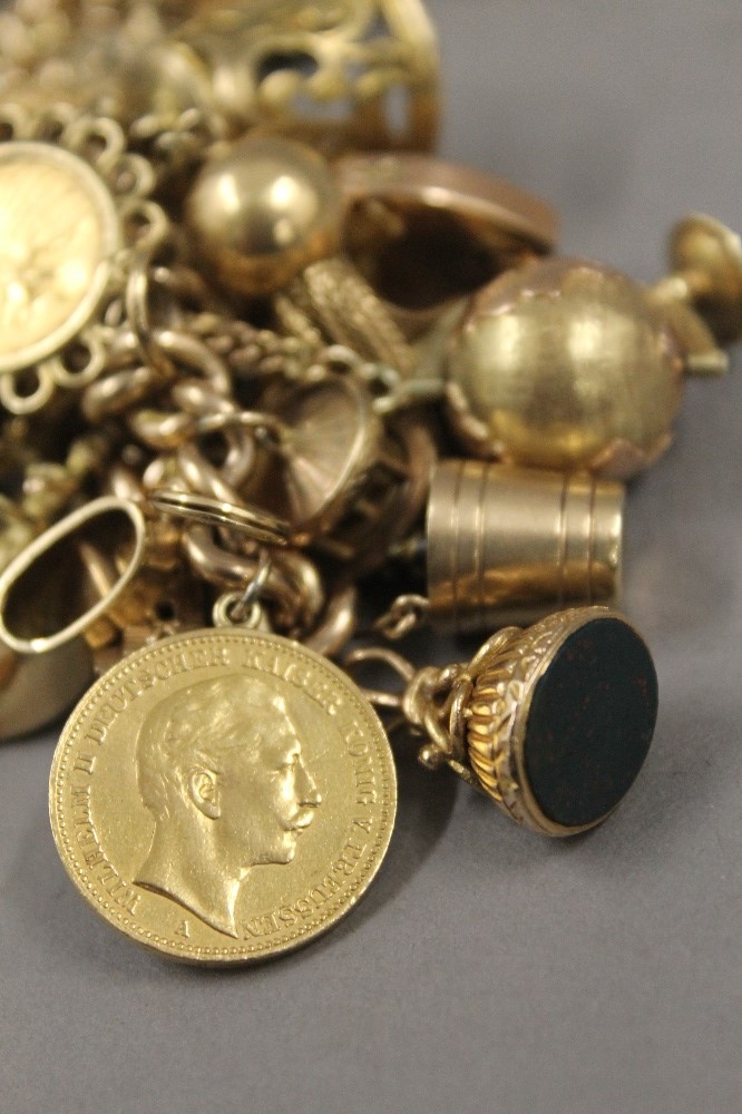 A 9 ct gold charm bracelet, set with various gold coins, including two sovereigns. 218. - Image 18 of 20