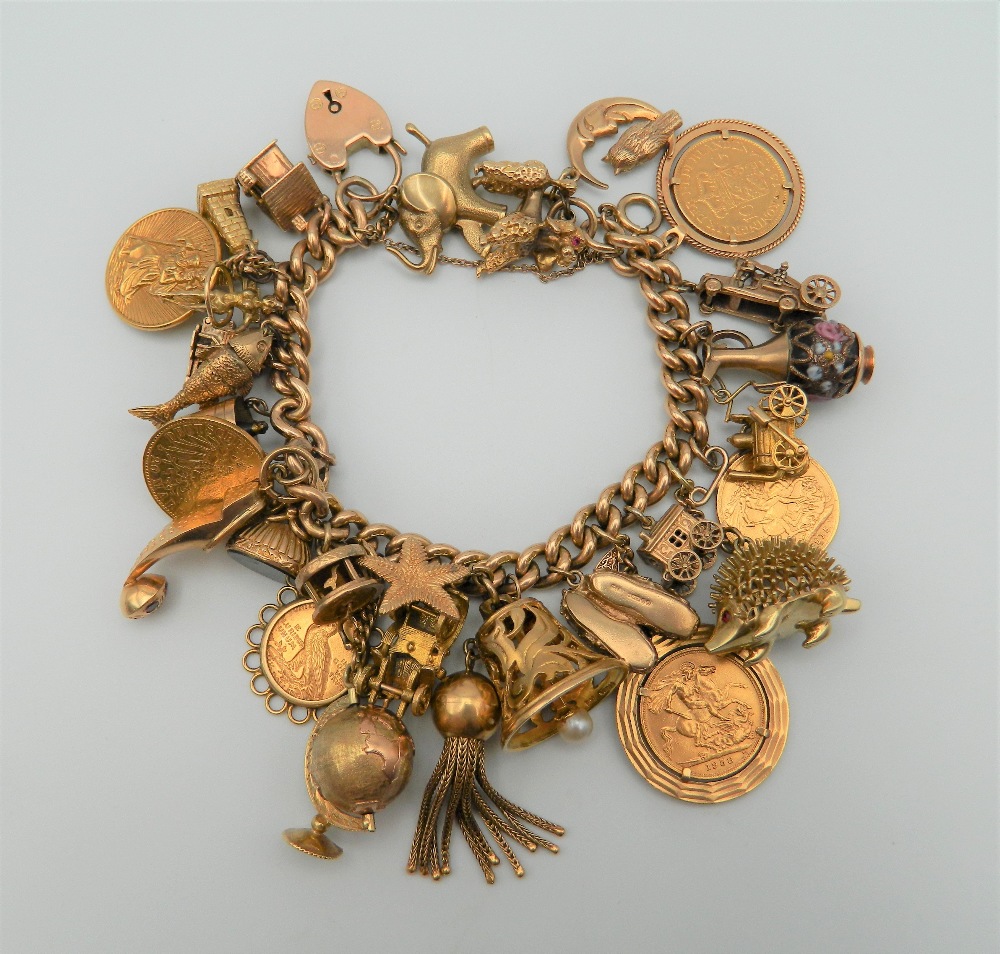 A 9 ct gold charm bracelet, set with various gold coins, including two sovereigns. 218.