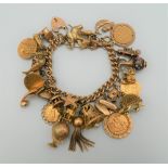 A 9 ct gold charm bracelet, set with various gold coins, including two sovereigns. 218.